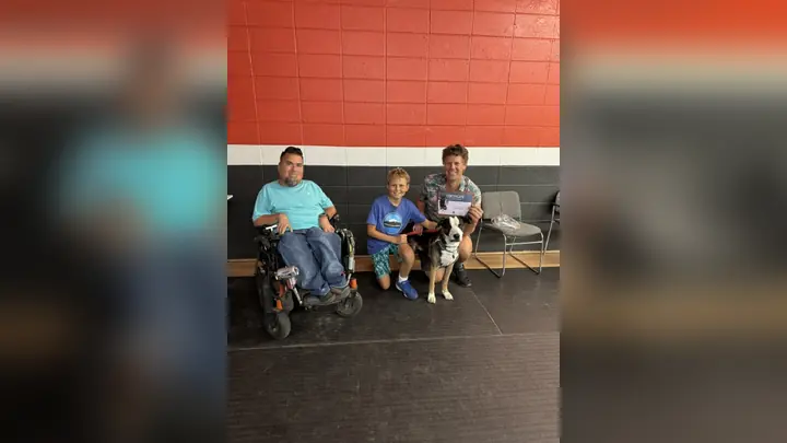 Jason Lake with graduates and a dog from the 163rd Basic Obedience Class at Prodogz in Medford, Oregon