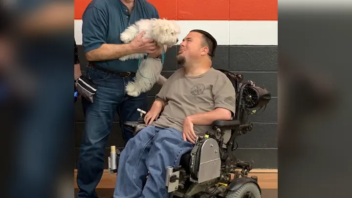 Dog greeting Jason Lake with a kiss after training at Prodogz Dog Training in Medford, Oregon — 2019–2026