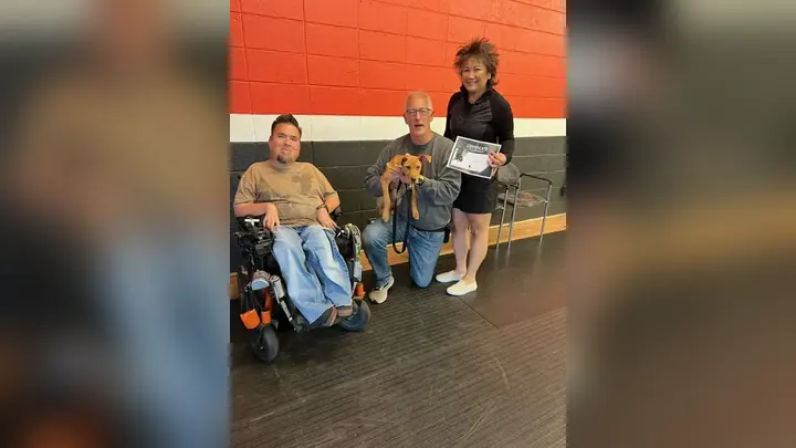 Clients and dogs in a Prodogz Dog Training puppy class led by Jason Lake in Medford, Oregon on April 12, 2024