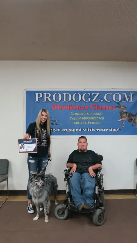 Clients and dogs in a Prodogz Dog Training basic obedience class led by Jason Lake in Medford, Oregon — October 22, 2018, photo 35
