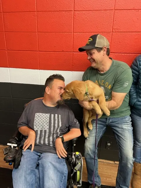 Clients and dogs in a Prodogz Dog Training puppy class led by Jason Lake in Medford, Oregon — November 25, 2022, photo 2