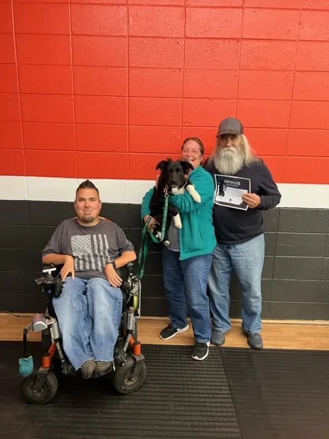 Clients and dogs in a Prodogz Dog Training puppy class led by Jason Lake in Medford, Oregon — November 25, 2022, photo 4
