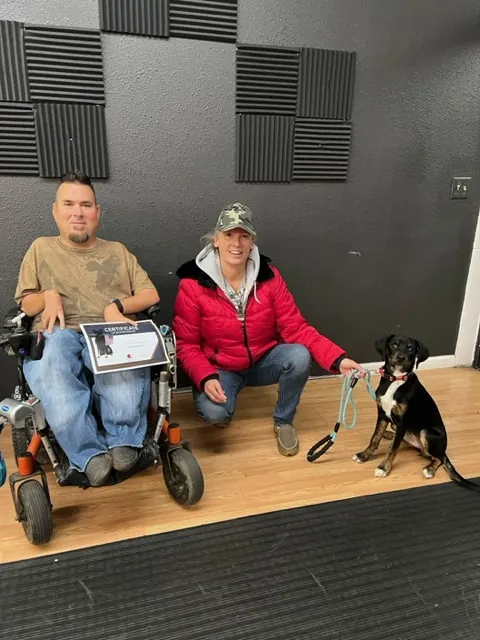 Clients and dogs in a Prodogz Dog Training puppy class led by Jason Lake in Medford, Oregon — December 16, 2022, photo 2
