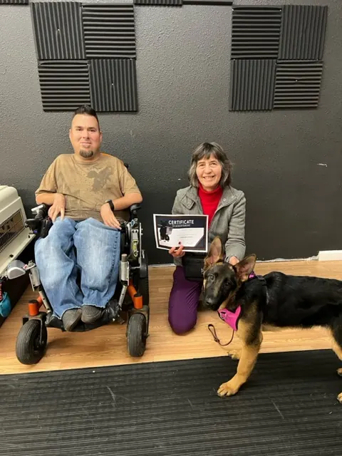 Clients and dogs in a Prodogz Dog Training puppy class led by Jason Lake in Medford, Oregon — December 16, 2022, photo 3