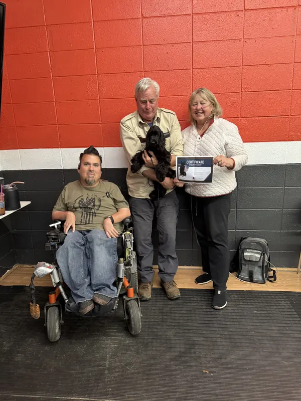 Clients and dogs in a Prodogz Dog Training puppy class led by Jason Lake in Medford, Oregon — March 7, 2025, photo 2