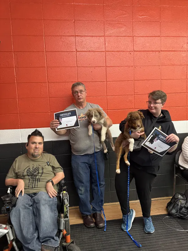 Clients and dogs in a Prodogz Dog Training puppy class led by Jason Lake in Medford, Oregon — March 7, 2025, photo 5