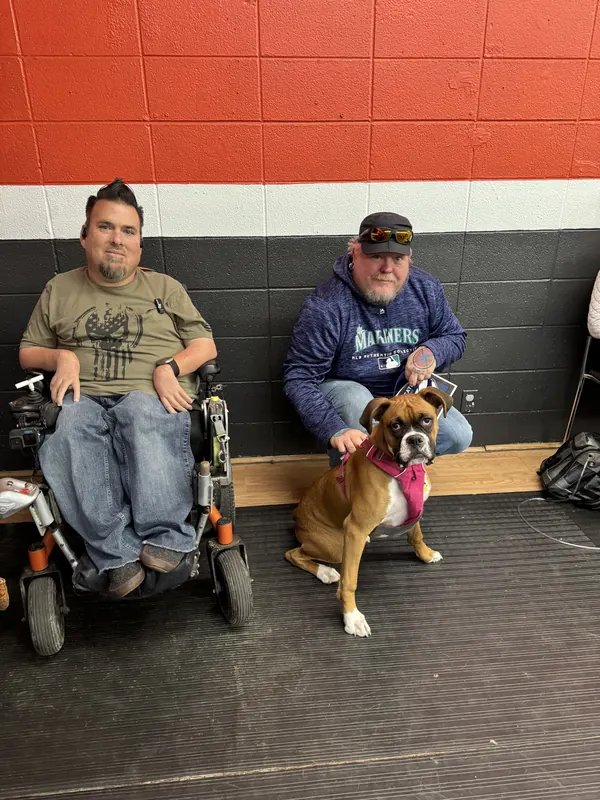 Clients and dogs in a Prodogz Dog Training puppy class led by Jason Lake in Medford, Oregon — March 7, 2025, photo 6